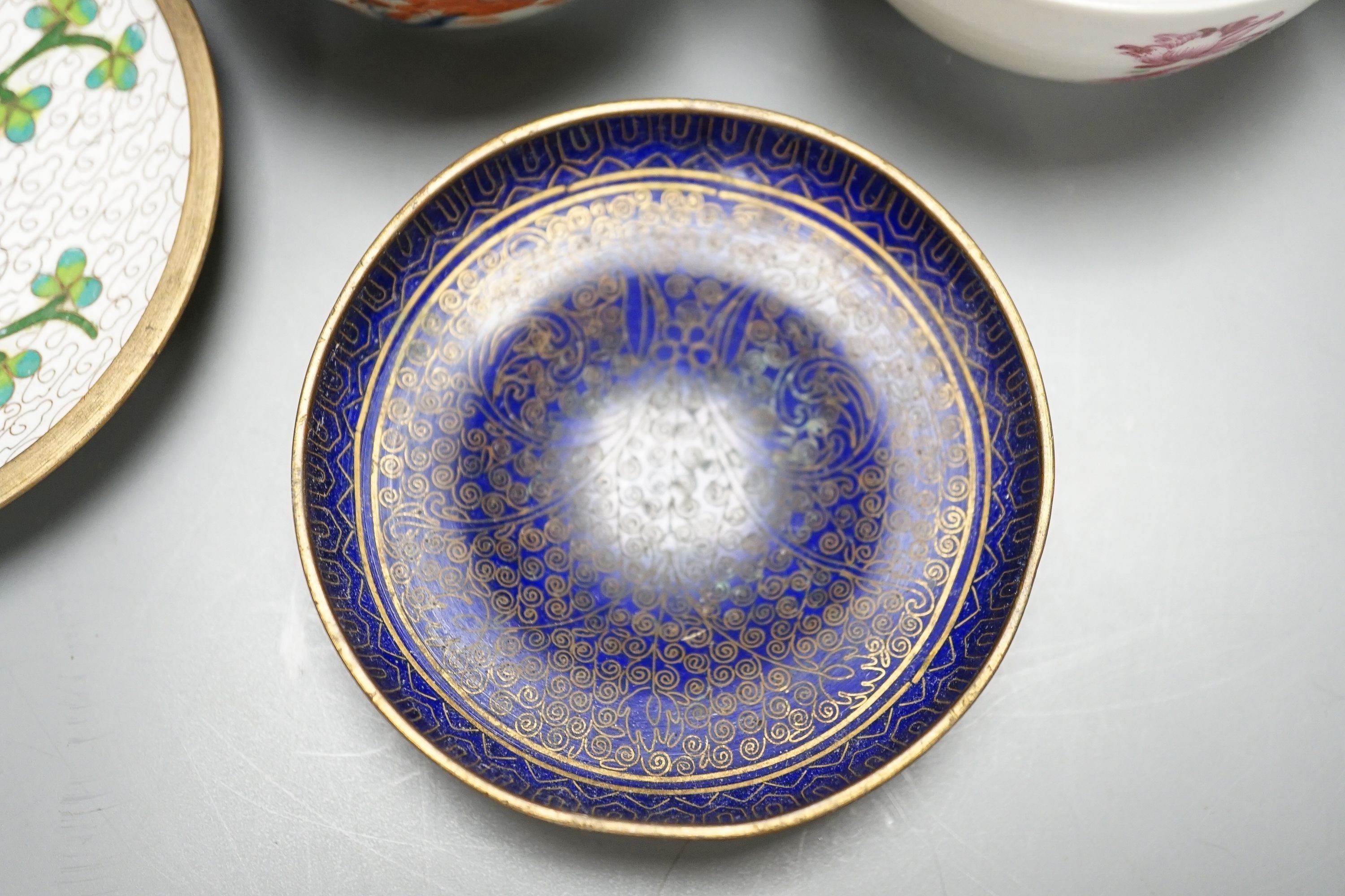 A collection of 18th century Chinese export porcelain tea bowls or cups and two cloisonné enamel dishes